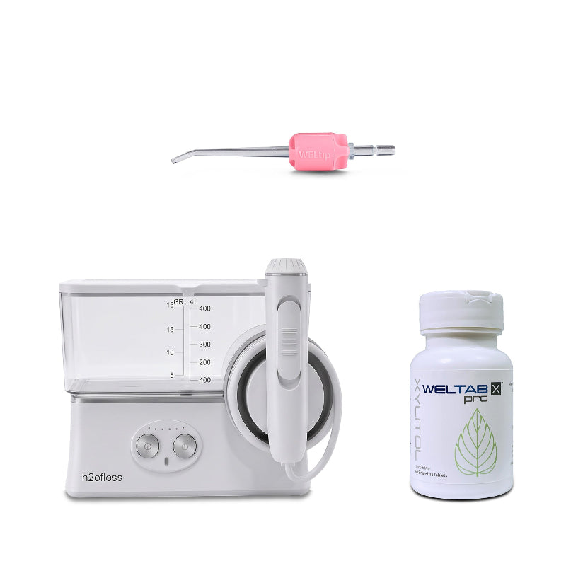 h2ofloss cordless water flosser with a pink weltip and a bottle of weltabs