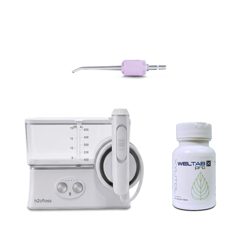 h2ofloss cordless water flosser with a purple weltip and a bottle of weltabs