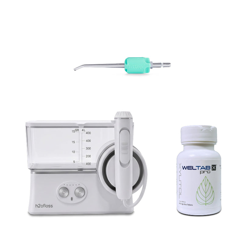 h2ofloss cordless water flosser with a seafoam weltip and a bottle of weltabs