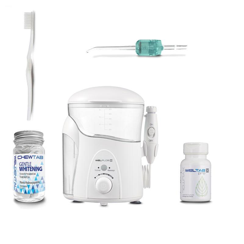 water flosser with nanohydroxyapatite toothpaste tablets
